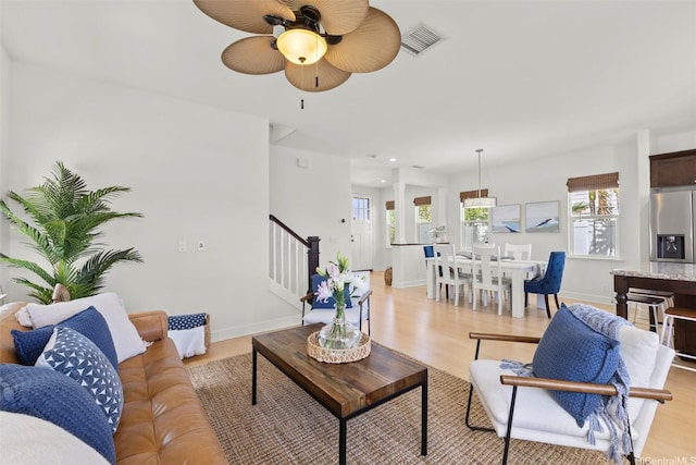 91-1112 Kai Oio St, Ewa Beach, HI 96706 - living area featuring stairway, a ceiling fan, healthy amount of natural light, light wood-type flooring, and recessed lighting