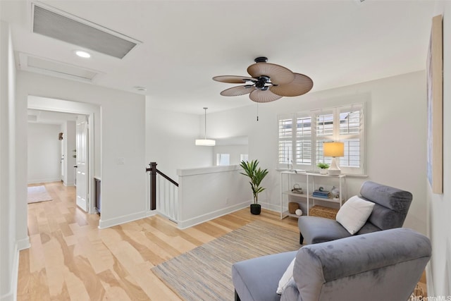 91-1112 Kai Oio St, Ewa Beach, HI 96706 - sitting room featuring an upstairs landing, attic access, light wood-style flooring, and ceiling fan