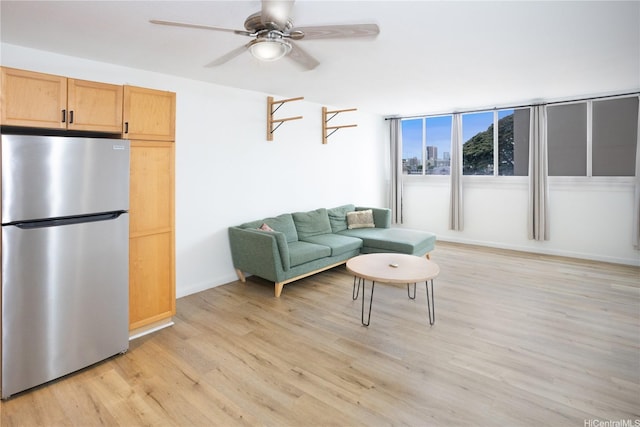 1617 Clark St Unit 404, Honolulu, HI 96822 - living area featuring light wood-type flooring and ceiling fan