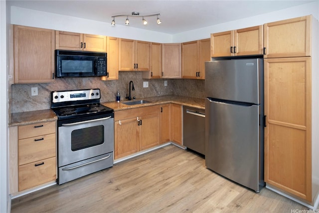 1617 Clark St Unit 404, Honolulu, HI 96822 - kitchen with stainless steel appliances, light wood-style floors, tasteful backsplash, and light brown cabinetry