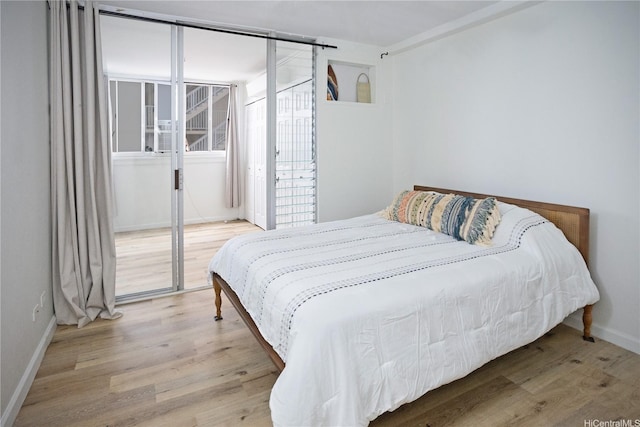 1617 Clark St Unit 404, Honolulu, HI 96822 - bedroom with wood finished floors and baseboards