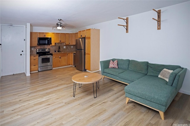 1617 Clark St Unit 404, Honolulu, HI 96822 - living area with light wood-type flooring and ceiling fan