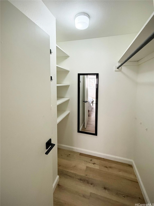 1617 Clark St Unit 404, Honolulu, HI 96822 - walk in closet featuring wood finished floors
