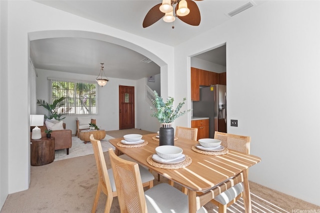 91-1032 Kauoha St, Ewa Beach, HI 96706 - dining area featuring arched walkways, light carpet, and a ceiling fan