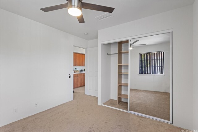 91-1032 Kauoha St, Ewa Beach, HI 96706 - unfurnished bedroom featuring light carpet, a closet, and ceiling fan