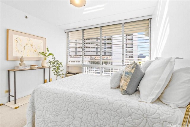 2522 Date St Unit 304, Honolulu, HI 96826 - bedroom featuring multiple windows and carpet