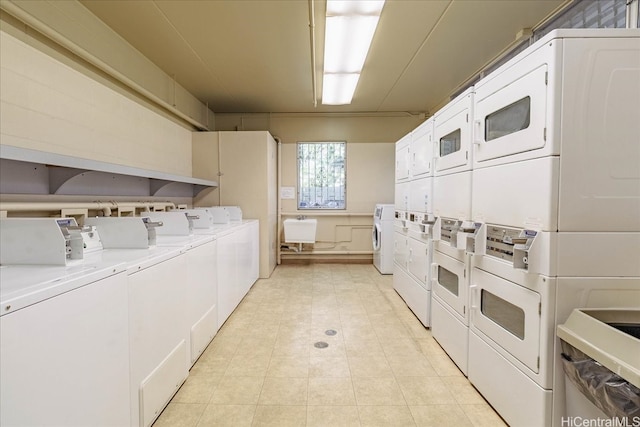 2522 Date St Unit 304, Honolulu, HI 96826 - shared laundry with stacked washer and clothes dryer, washer and clothes dryer, and light tile patterned flooring