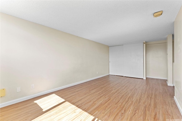 1060 Kamehameha Hwy Unit 801A, Pearl City, HI 96782 - unfurnished bedroom with wood finished floors and a textured ceiling