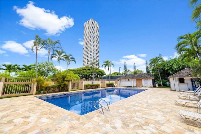 1060 Kamehameha Hwy Unit 801A, Pearl City, HI 96782 - community pool featuring a patio area and a storage shed