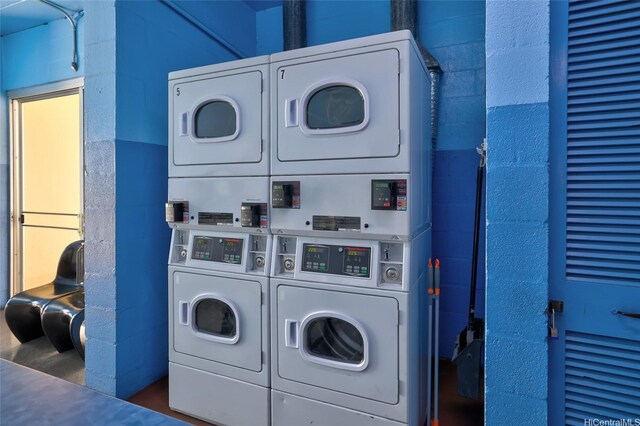 910 Ahana St Unit 508, Honolulu, HI 96814 - communal laundry room featuring stacked washer / drying machine, concrete block wall, and washer and dryer