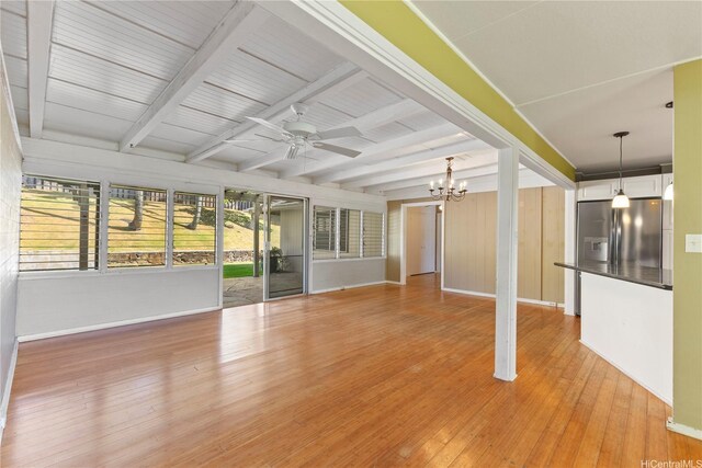 439 Ilimano St, Kailua, HI 96734 - unfurnished living room with a chandelier, ceiling fan, beam ceiling, and light wood-type flooring