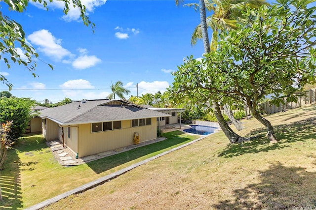 439 Ilimano St, Kailua, HI 96734 - back of property featuring roof with shingles, an outdoor pool, and a patio area