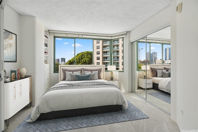1314 Kalakaua Ave Unit 302, Honolulu, HI 96826 - carpeted bedroom with a textured ceiling and a city view