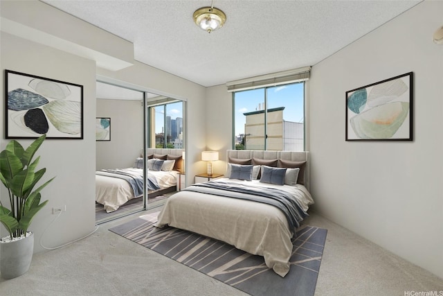 1314 Kalakaua Ave Unit 302, Honolulu, HI 96826 - carpeted bedroom featuring a textured ceiling and a closet