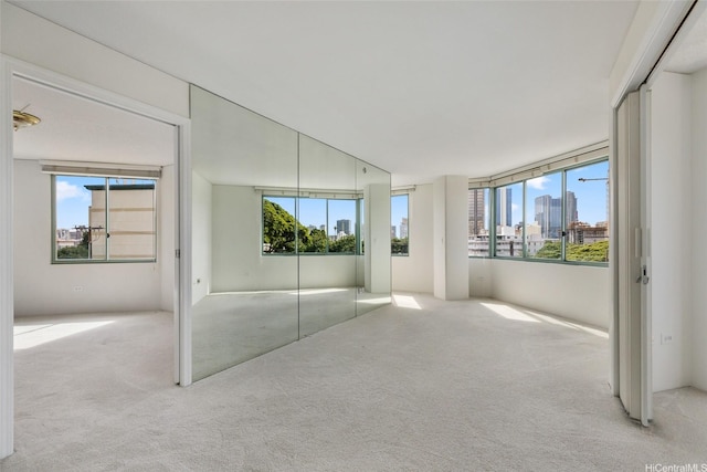 1314 Kalakaua Ave Unit 302, Honolulu, HI 96826 - unfurnished bedroom with carpet floors, multiple windows, and a view of skyline