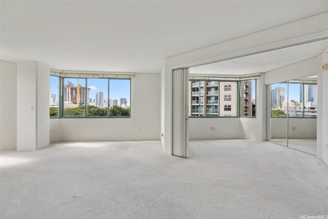 1314 Kalakaua Ave Unit 302, Honolulu, HI 96826 - unfurnished bedroom featuring carpet flooring and a view of skyline