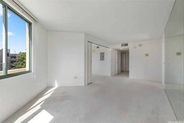 1314 Kalakaua Ave Unit 302, Honolulu, HI 96826 - spare room with plenty of natural light, light colored carpet, and electric panel