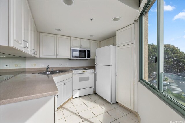 1314 Kalakaua Ave Unit 302, Honolulu, HI 96826 - kitchen featuring white appliances, white cabinets, light tile patterned floors, light countertops, and recessed lighting