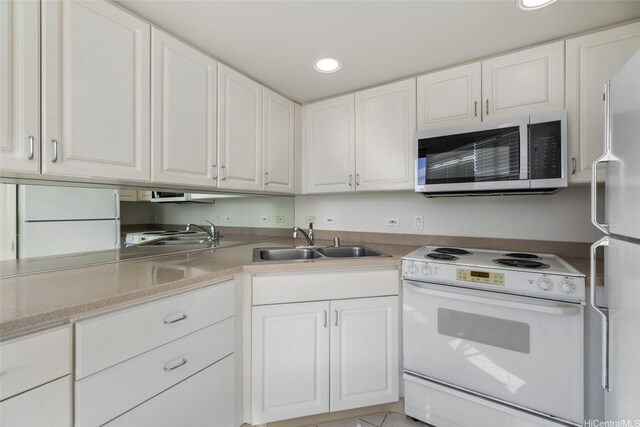 1314 Kalakaua Ave Unit 302, Honolulu, HI 96826 - kitchen featuring white appliances, recessed lighting, white cabinetry, and light countertops