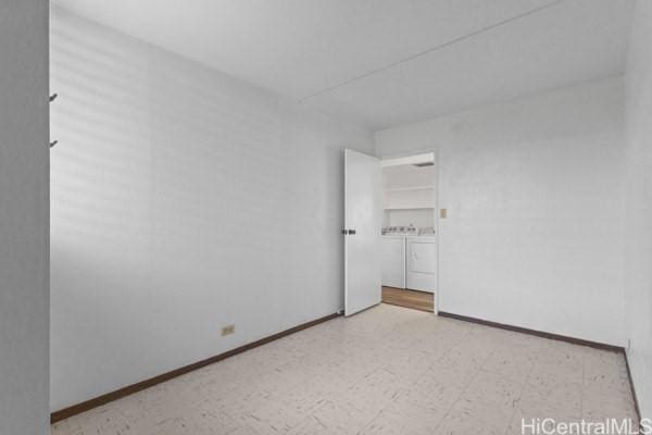 94-333 Hokuahiahi St Unit 103, Mililani, HI 96789 - empty room with independent washer and dryer and tile patterned floors