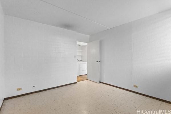 94-333 Hokuahiahi St Unit 103, Mililani, HI 96789 - unfurnished room with washer / dryer and tile patterned floors