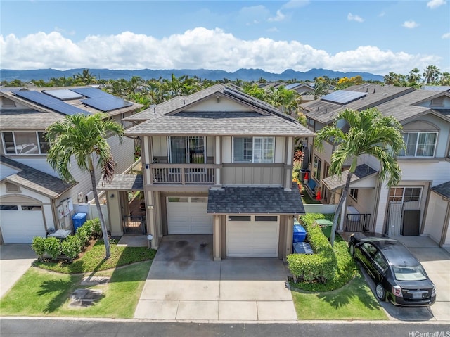 91-1200 Keaunui Dr Unit 110, Ewa Beach, HI 96706 - multi unit property featuring a shingled roof, driveway, an attached garage, and a mountain view