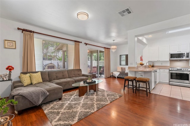 91-1200 Keaunui Dr Unit 110, Ewa Beach, HI 96706 - living room with wood finished floors