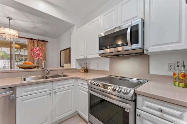 91-1200 Keaunui Dr Unit 110, Ewa Beach, HI 96706 - kitchen featuring appliances with stainless steel finishes, white cabinetry, and light countertops