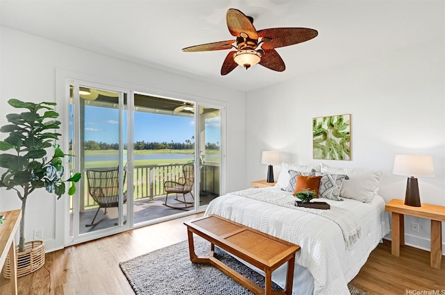 91-1227 Kuanoo St, Ewa Beach, HI 96706 - bedroom with a water view, access to outside, wood finished floors, and a ceiling fan