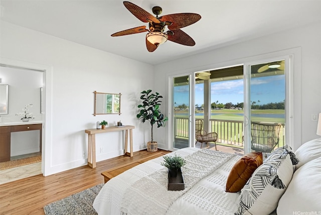 91-1227 Kuanoo St, Ewa Beach, HI 96706 - bedroom with light wood-style floors, access to exterior, connected bathroom, view of golf course, and a ceiling fan