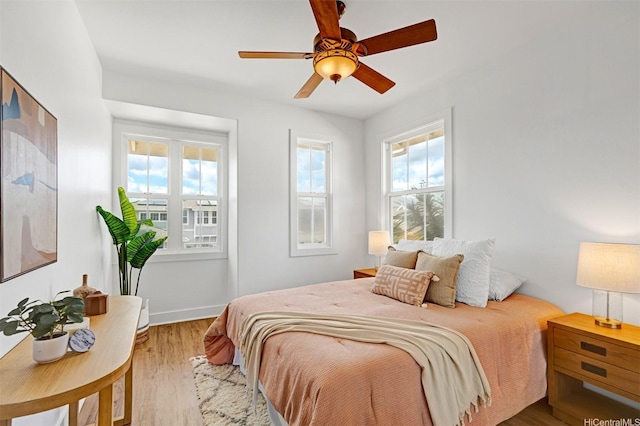 91-1227 Kuanoo St, Ewa Beach, HI 96706 - bedroom featuring wood finished floors and a ceiling fan