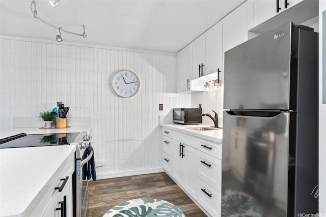53-567 Kamehameha Hwy Unit 203, Hauula, HI 96717 - kitchen with freestanding refrigerator, electric range oven, light countertops, and white cabinetry
