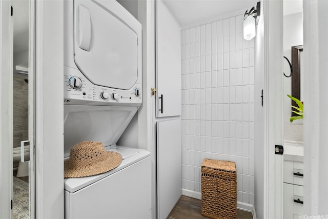 53-567 Kamehameha Hwy Unit 203, Hauula, HI 96717 - washroom featuring estacked washer and dryer and tile walls