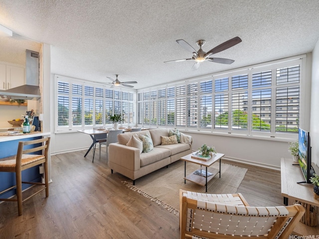 1545 Nehoa St Unit 101, Honolulu, HI 96822 - living room with a textured ceiling, a ceiling fan, and wood finished floors