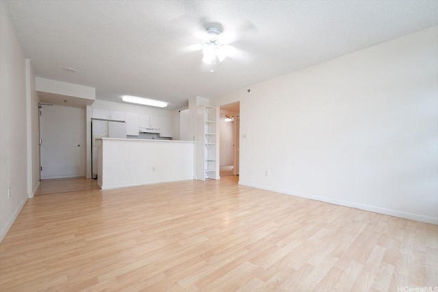 1448 Young St Unit 202, Honolulu, HI 96814 - unfurnished living room featuring light wood finished floors and a ceiling fan