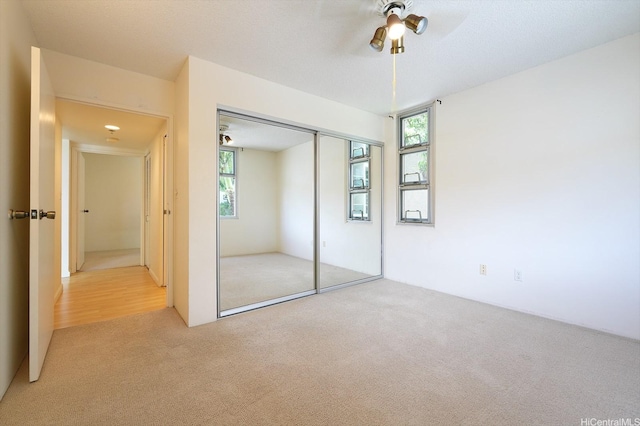 1448 Young St Unit 202, Honolulu, HI 96814 - unfurnished bedroom featuring carpet, a closet, and ceiling fan