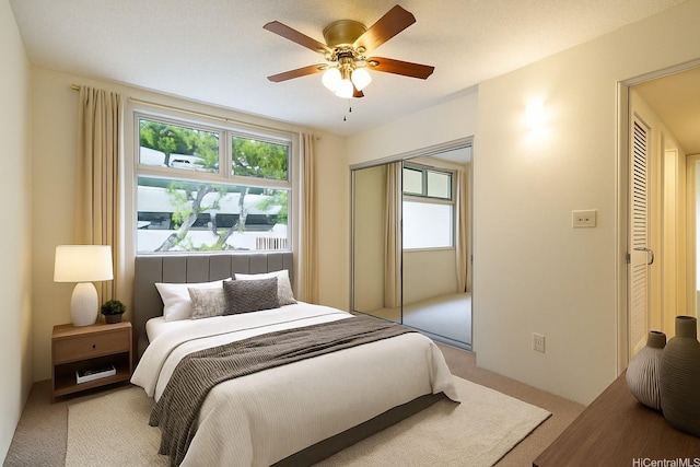 1448 Young St Unit 202, Honolulu, HI 96814 - bedroom featuring light colored carpet, a closet, and a ceiling fan