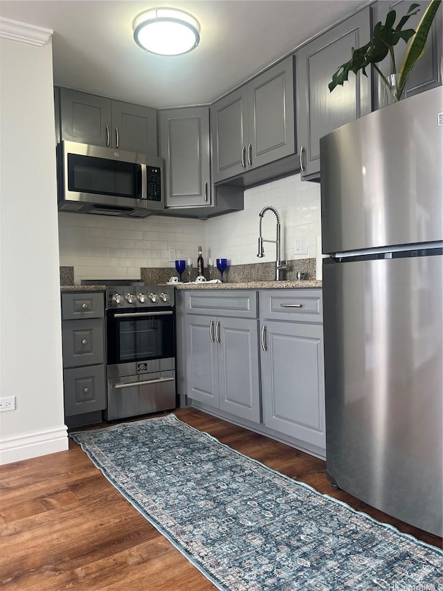 2888 Ala Ilima St Unit 1508, Honolulu, HI 96818 - kitchen with stainless steel appliances, gray cabinets, and tasteful backsplash