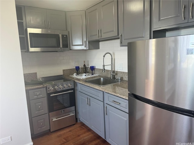2888 Ala Ilima St Unit 1508, Honolulu, HI 96818 - kitchen with appliances with stainless steel finishes, gray cabinets, dark wood-type flooring, and tasteful backsplash
