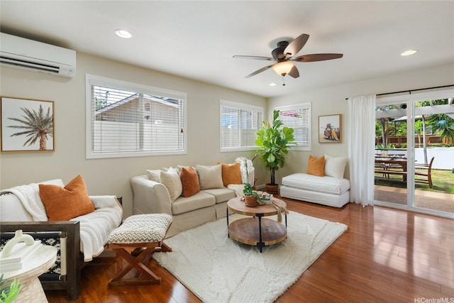 66-912 Kamakahala St Unit 2, Waialua, HI 96791 - living area with a wall mounted AC, wood finished floors, ceiling fan, and recessed lighting