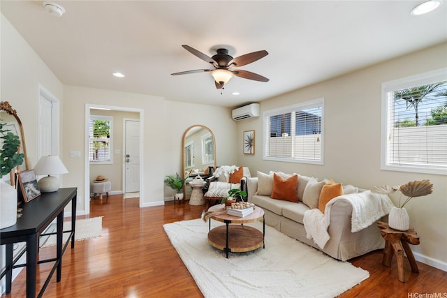 66-912 Kamakahala St Unit 2, Waialua, HI 96791 - living area featuring a wall mounted AC, healthy amount of natural light, wood finished floors, and recessed lighting
