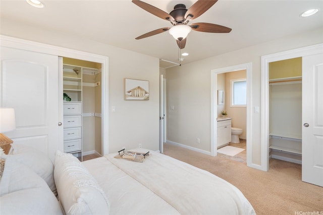 66-912 Kamakahala St Unit 2, Waialua, HI 96791 - bedroom featuring a walk in closet, light carpet, a closet, ensuite bath, and ceiling fan