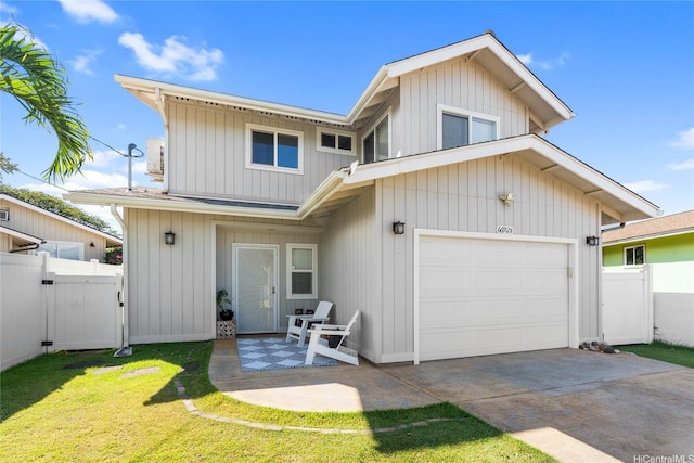 66-912 Kamakahala St Unit 2, Waialua, HI 96791 - view of front of home with a garage, driveway, a gate, and a patio