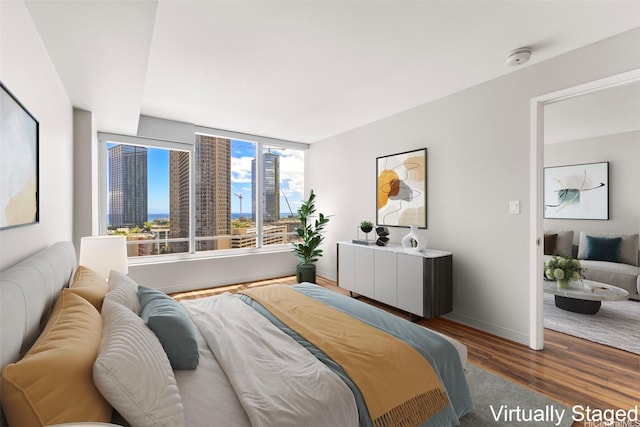 1009 Kapiolani Blvd Unit 1706, Honolulu, HI 96814 - bedroom featuring wood finished floors and baseboards