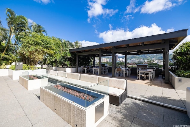 1009 Kapiolani Blvd Unit 1706, Honolulu, HI 96814 - view of patio featuring outdoor dining area, a gazebo, and an outdoor fire pit