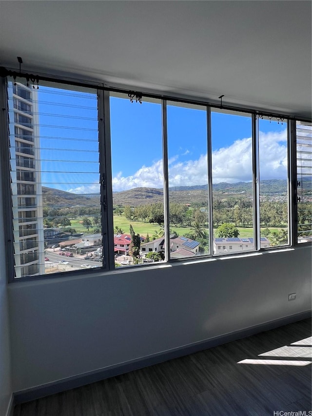 5210 Likini St Unit 901, Honolulu, HI 96818 - spare room with wood finished floors, plenty of natural light, and a mountain view