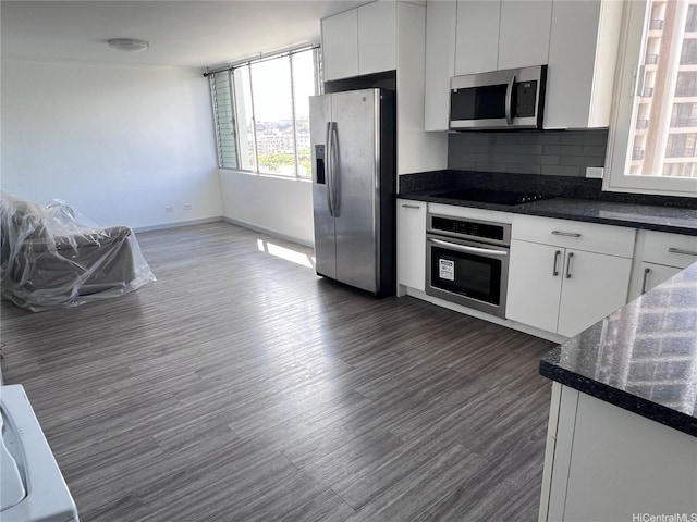 5210 Likini St Unit 901, Honolulu, HI 96818 - kitchen featuring appliances with stainless steel finishes, dark countertops, and backsplash