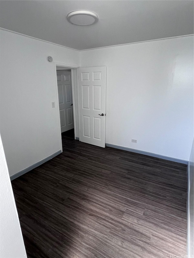 5210 Likini St Unit 901, Honolulu, HI 96818 - unfurnished room with dark wood-style floors and baseboards