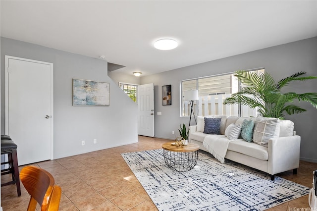 91-1021 Kuina St Unit 119, Ewa Beach, HI 96706 - living room featuring light tile patterned floors and baseboards