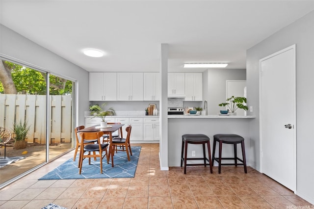 91-1021 Kuina St Unit 119, Ewa Beach, HI 96706 - dining area with light tile patterned flooring